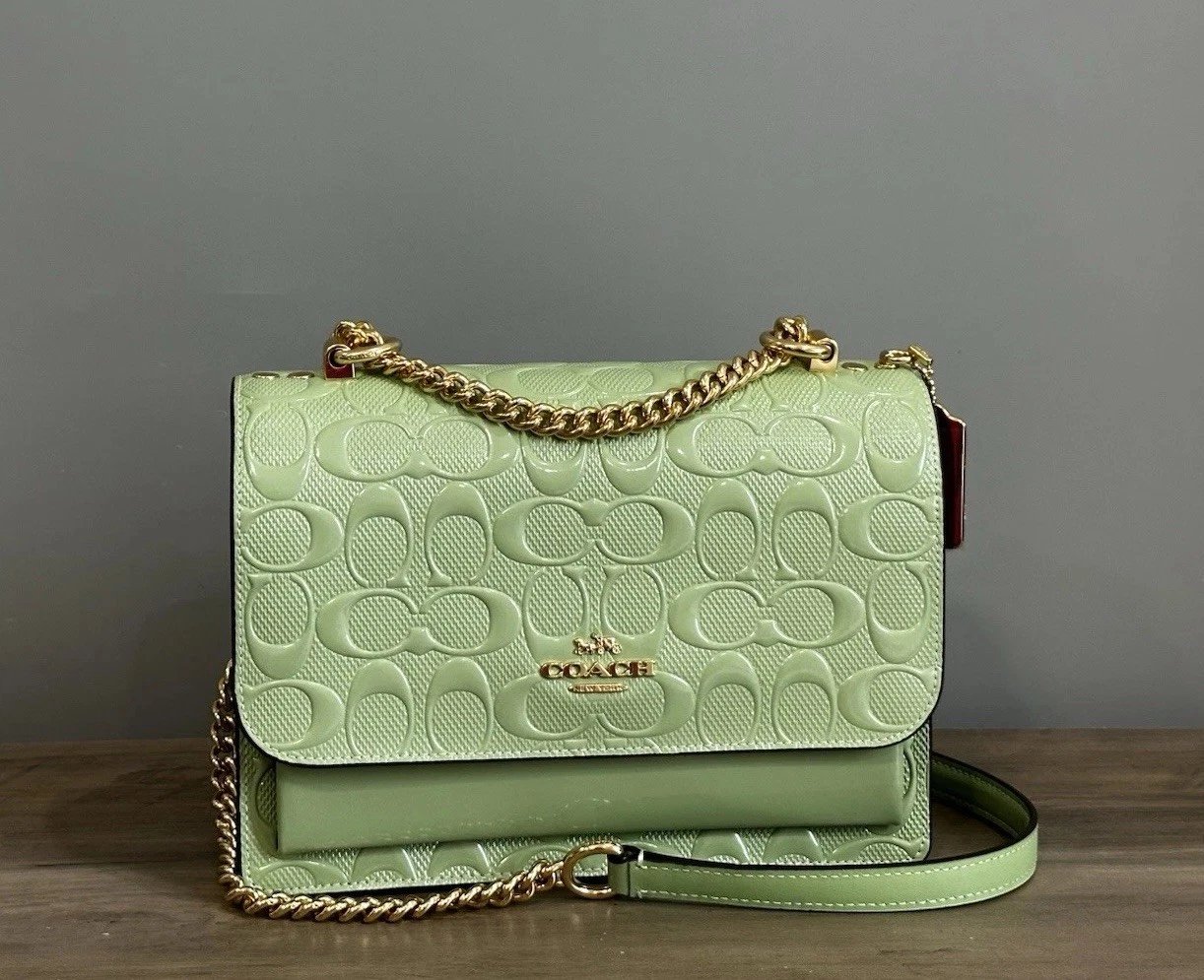 Coach Clear Crossbody Bag, brand new with tags, crafted from premium patent leather. Model number CDA97